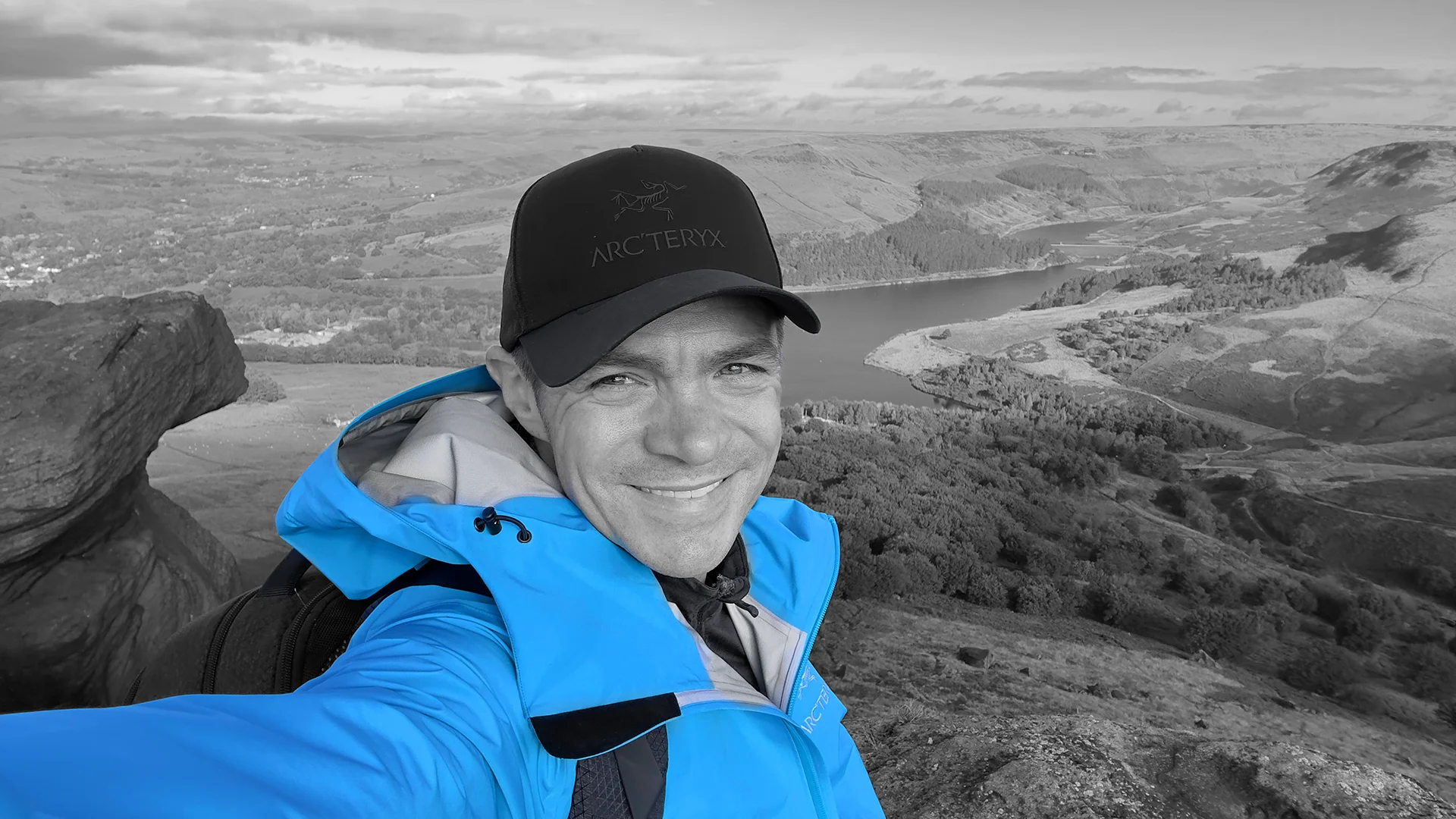 Scott Green overlooking a Saddleworth reservoir landscape, outdoor portrait for MUVE®.